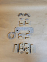 Load image into Gallery viewer, A set of various shaped felt wipers for a Monarch lathe, displayed on a beige background. 